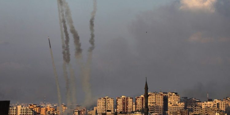 Hamas launches massive rocket barrage as Israel delays invasion