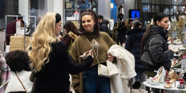 Americans ramped up spending during the holidays despite some financial anxiety and higher costs