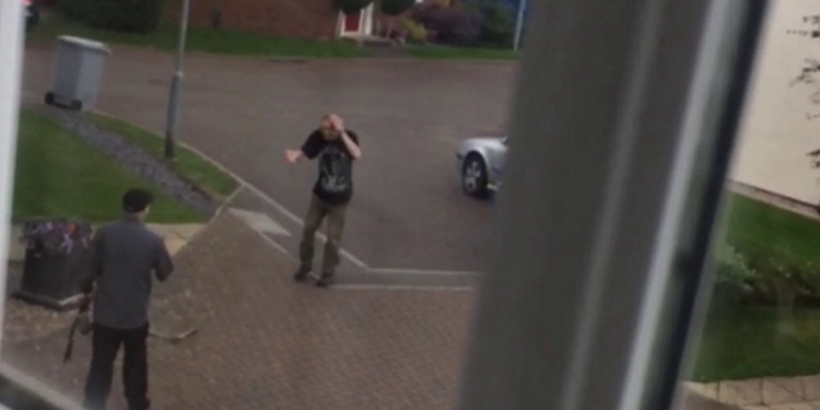 Neighbors caught on camera fighting each other with garden tools in quiet cul-de-sac