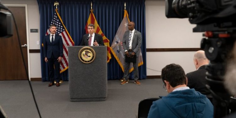 Federal officials say 20 have been charged for threatening election workers