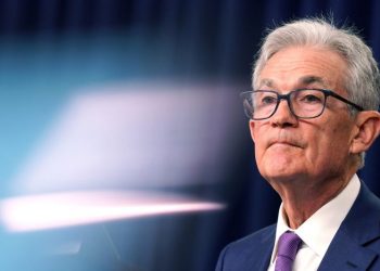 Fed holds interest rates but keeps door open to a cut in coming months