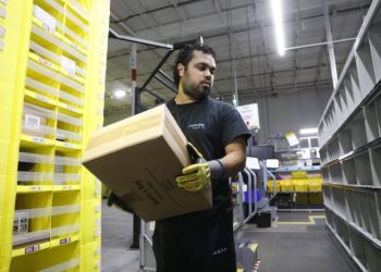 Amazon increases average pay for warehouse workers and adds free Prime membership perk